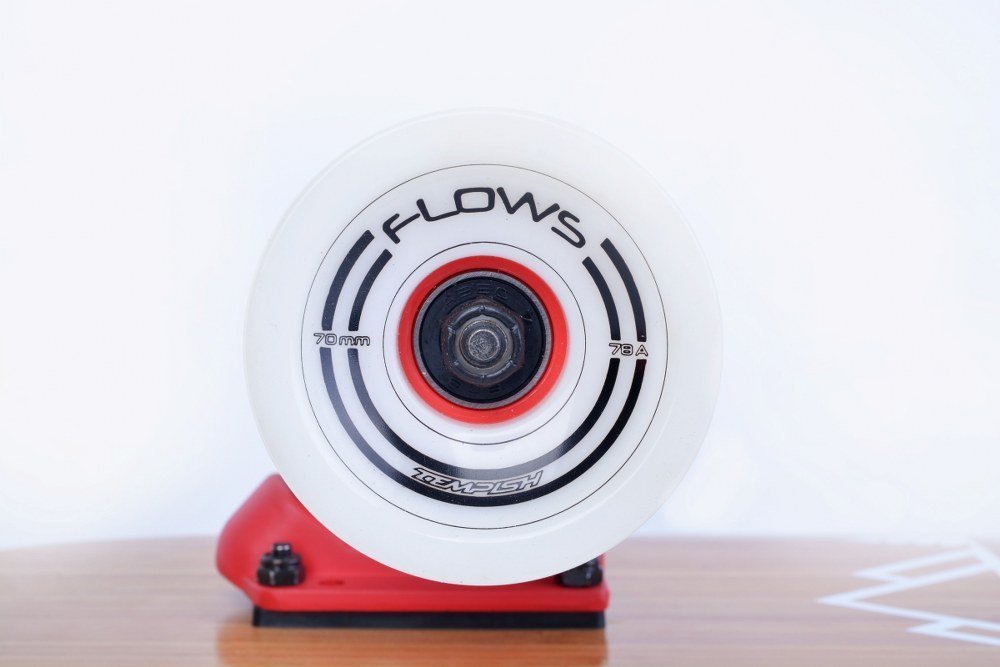 Tempish Flow longboard drop-through mounting and reverse-kingpin trucks